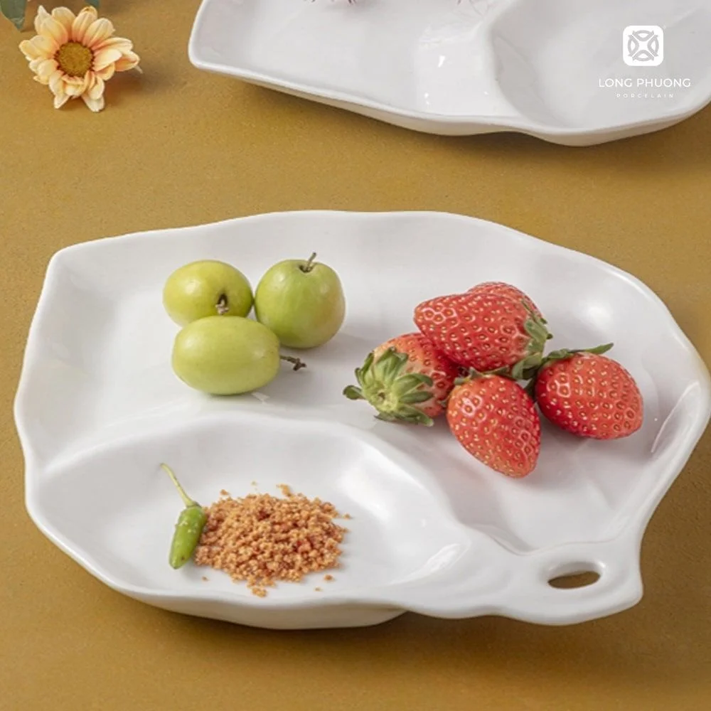 Leaf-Shaped Two-Compartment Plate (4) Leaf-Shaped two-compartment plates 11” by Long Phuong