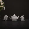 Round-bellied teapot with floral vine motifs