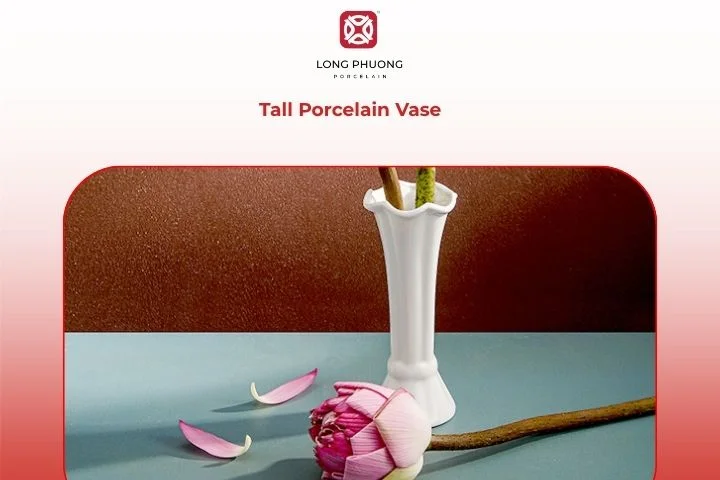 Tall porcelain vase standing beside a window, filled with fresh white lilies, creating a clean and airy vibe