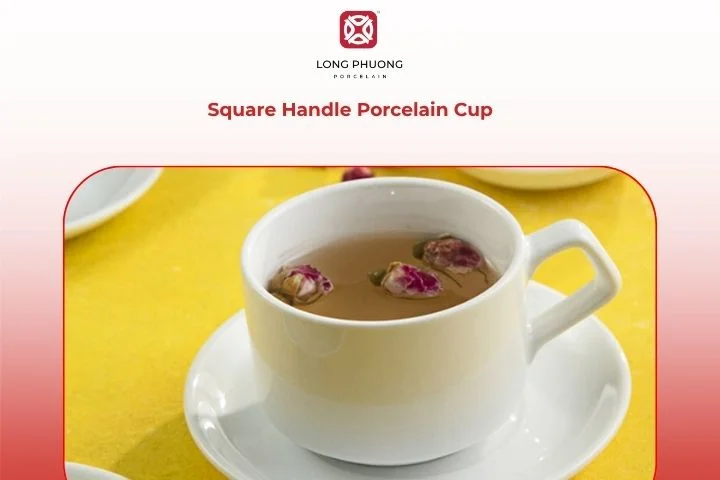Square handle porcelain cup with a hot latte and stylish spoon beside it