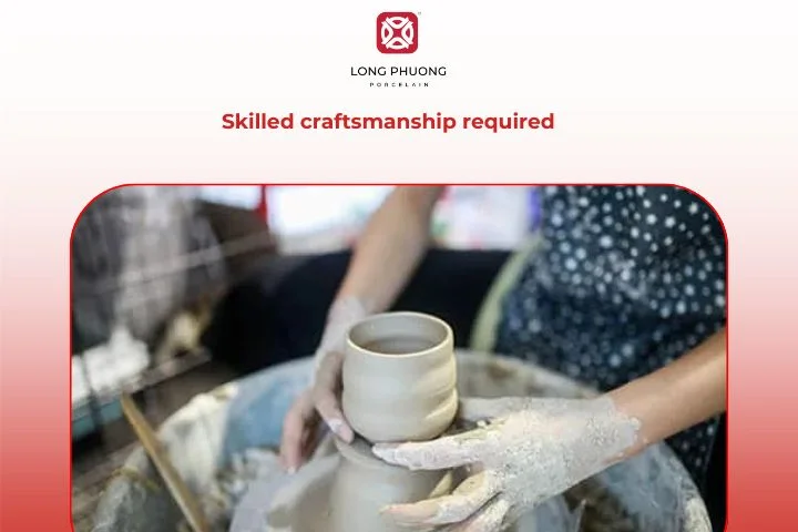 Craftsman decorating porcelain vase