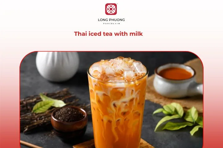 Classic Thai iced tea with milk in tall porcelain glass