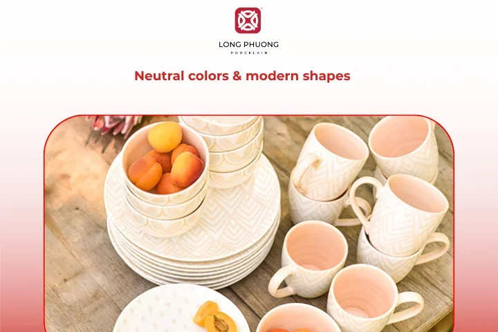 Neutral-colored porcelain tableware with clean lines on a minimalist dining table