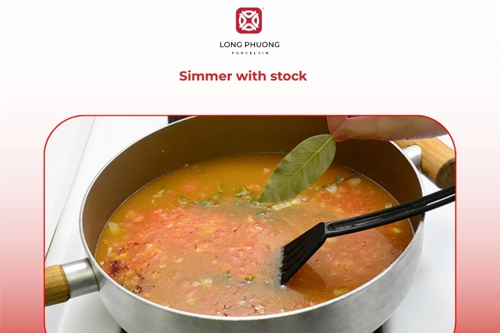 A pot of seafood broth slowly infused with herbs and saffron