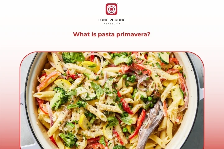 Colorful primavera pasta with mixed seasonal vegetables and herbs
